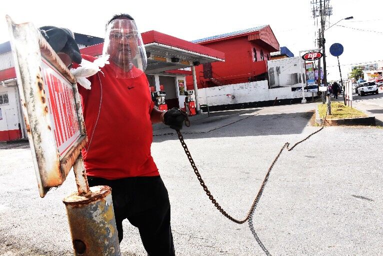 An employee closes a gas station